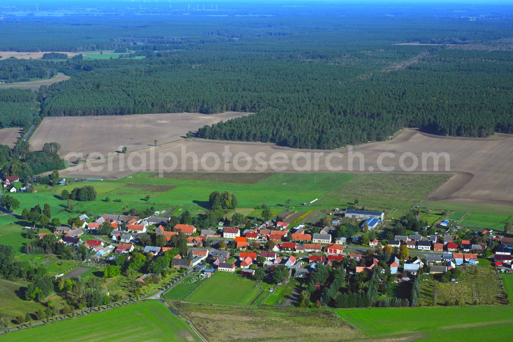 Rossow from above - Agricultural land and field boundaries surround the settlement area of the village in Rossow in the state Brandenburg, Germany