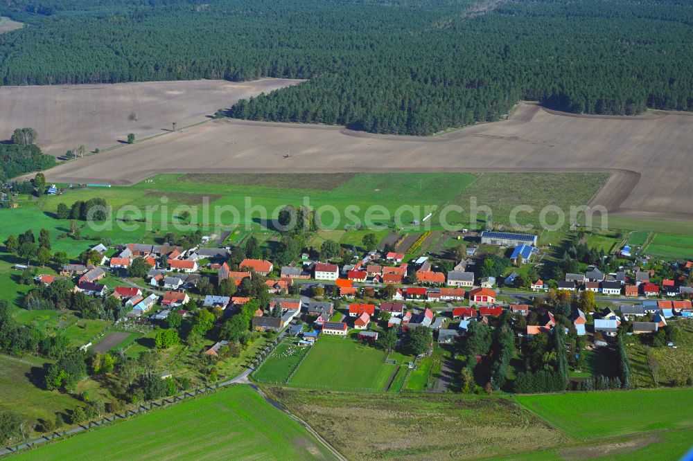 Rossow from the bird's eye view: Agricultural land and field boundaries surround the settlement area of the village in Rossow in the state Brandenburg, Germany