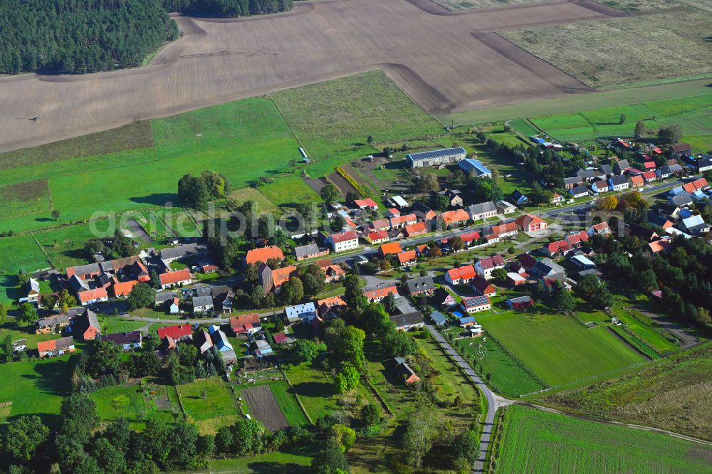 Aerial photograph Rossow - Agricultural land and field boundaries surround the settlement area of the village in Rossow in the state Brandenburg, Germany