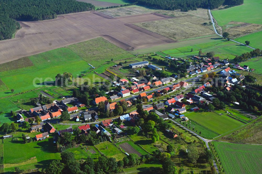 Rossow from above - Agricultural land and field boundaries surround the settlement area of the village in Rossow in the state Brandenburg, Germany