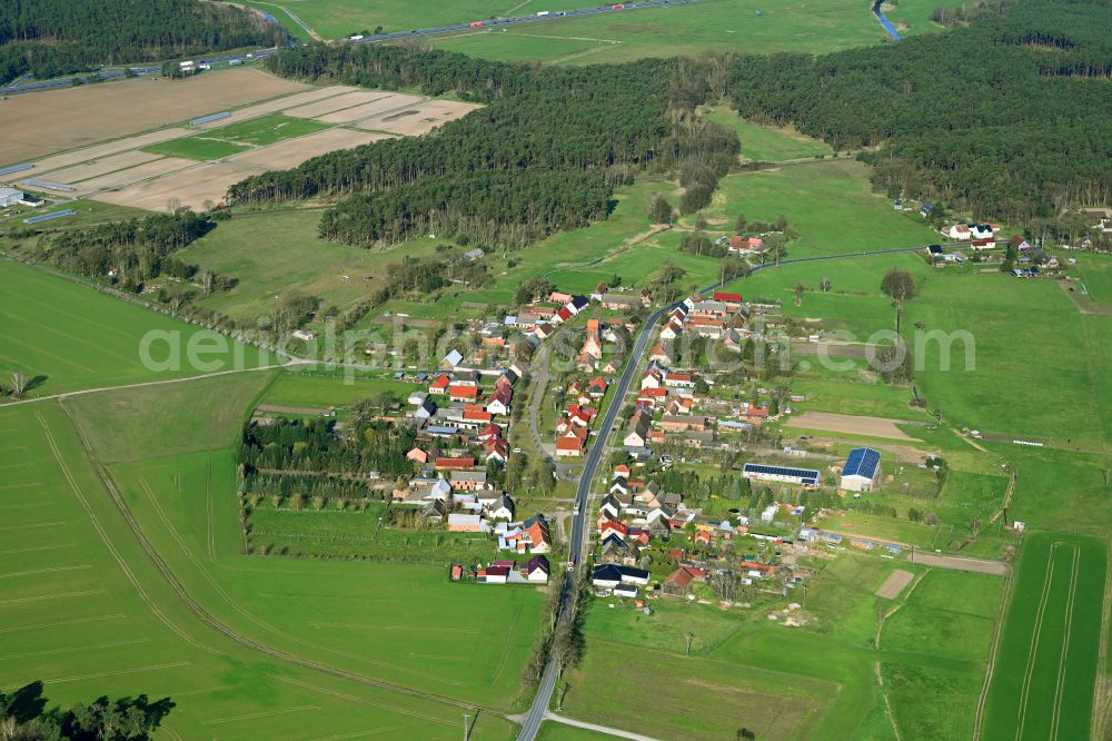 Rossow from above - Agricultural land and field boundaries surround the settlement area of the village in Rossow in the state Brandenburg, Germany