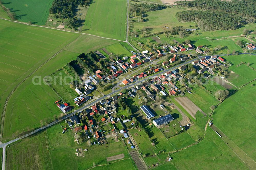 Rossow from the bird's eye view: Agricultural land and field boundaries surround the settlement area of the village in Rossow in the state Brandenburg, Germany