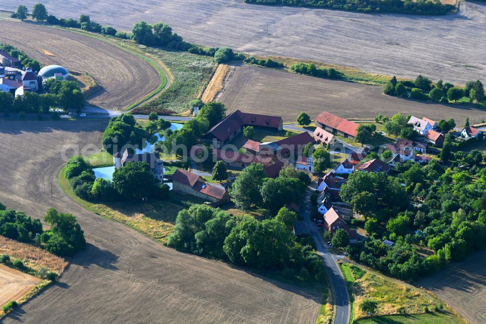 Roßrieth from above - Agricultural land and field boundaries surround the settlement area of the village in Roßrieth in the state Bavaria, Germany