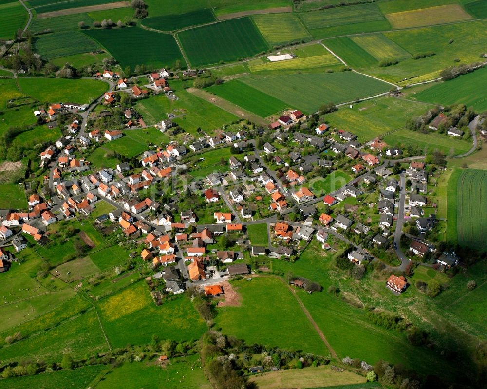 Aerial photograph Rotensee - Agricultural land and field boundaries surround the settlement area of the village in Rotensee in the state Hesse, Germany