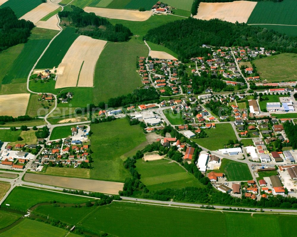 Rott am Wald from above - Agricultural land and field boundaries surround the settlement area of the village in Rott am Wald in the state Bavaria, Germany