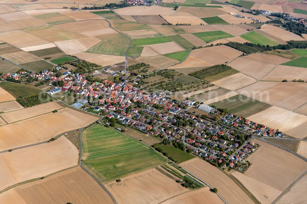 Aerial photograph Röttbach - Agricultural land and field boundaries surround the settlement area of the village in Röttbach in the state Bavaria, Germany