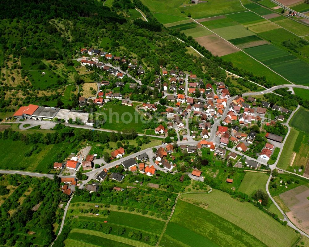 Rudersberg from the bird's eye view: Agricultural land and field boundaries surround the settlement area of the village in Rudersberg in the state Baden-Wuerttemberg, Germany