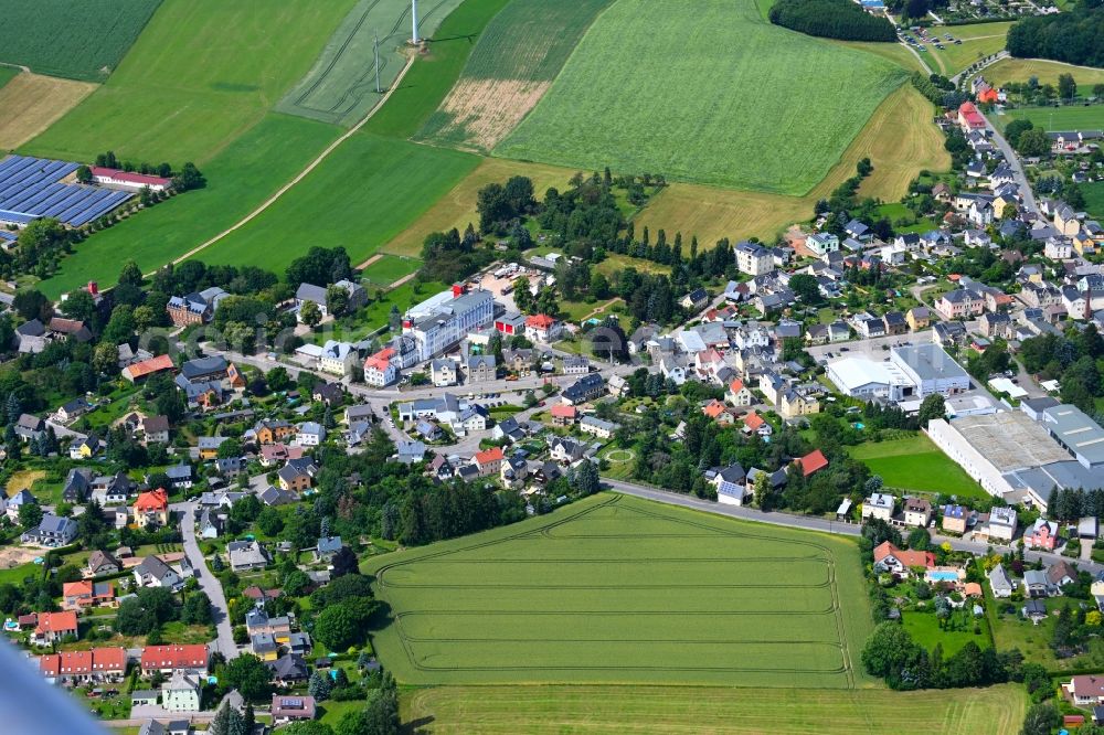 Rußdorf from above - Agricultural land and field boundaries surround the settlement area of the village in Russdorf in the state Saxony, Germany