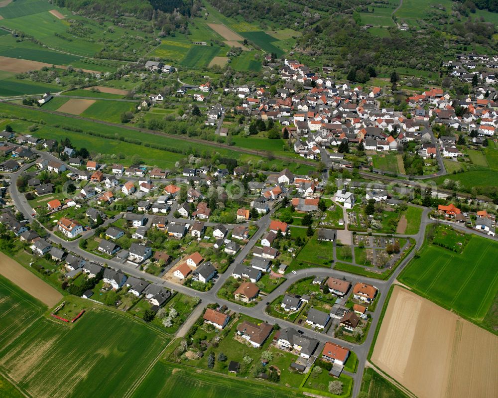 Aerial image Saasen - Agricultural land and field boundaries surround the settlement area of the village in Saasen in the state Hesse, Germany