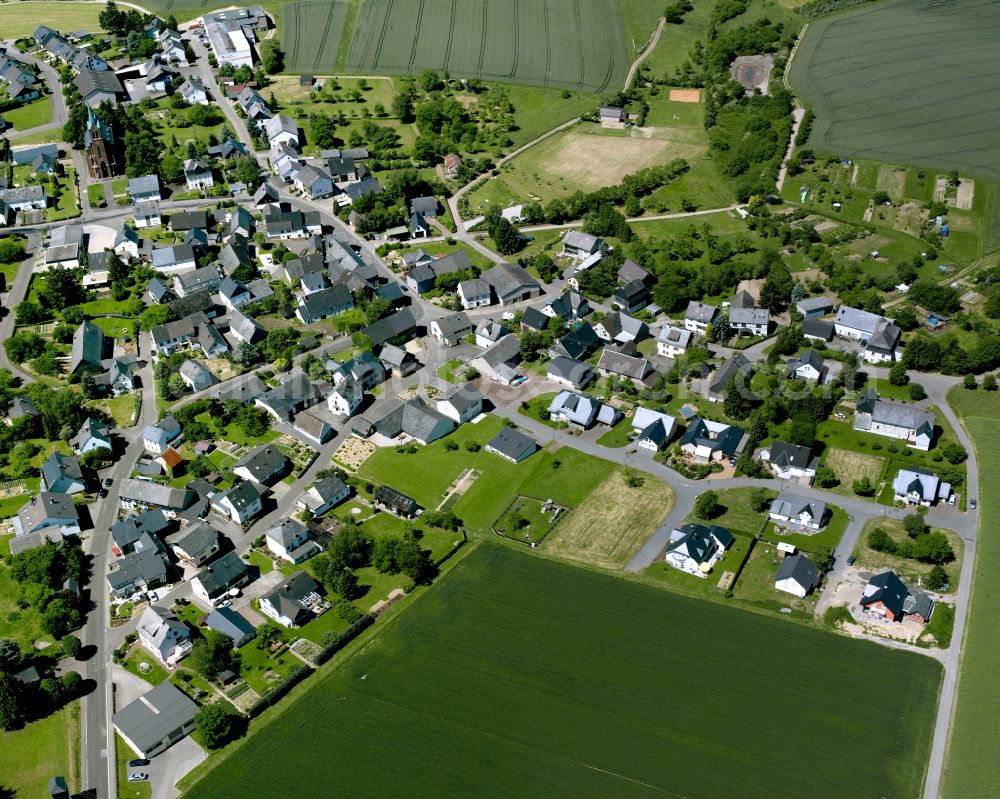 Aerial image Sabershausen - Agricultural land and field boundaries surround the settlement area of the village in Sabershausen in the state Rhineland-Palatinate, Germany