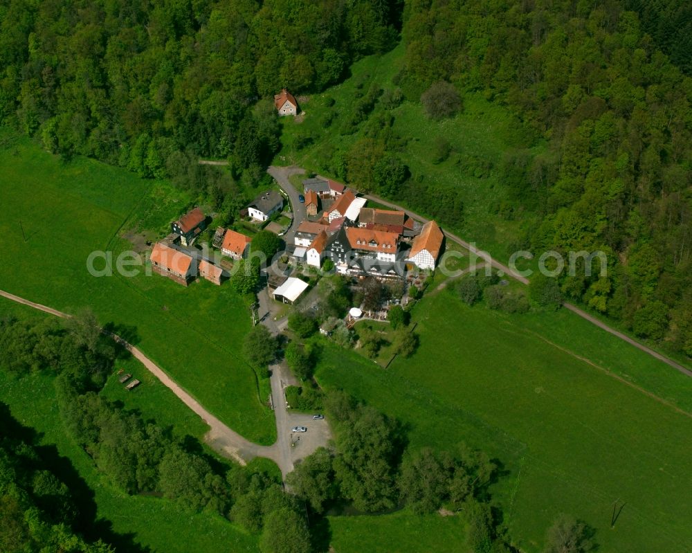 Aerial photograph Salzböden - Agricultural land and field boundaries surround the settlement area of the village in Salzböden in the state Hesse, Germany