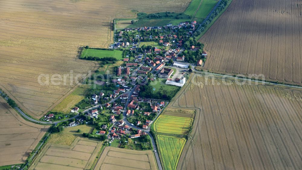 Sambleben from the bird's eye view: Agricultural land and field boundaries surround the settlement area of the village in Sambleben in the state Lower Saxony, Germany