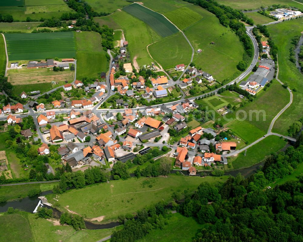 Sandlofs from the bird's eye view: Agricultural land and field boundaries surround the settlement area of the village in Sandlofs in the state Hesse, Germany