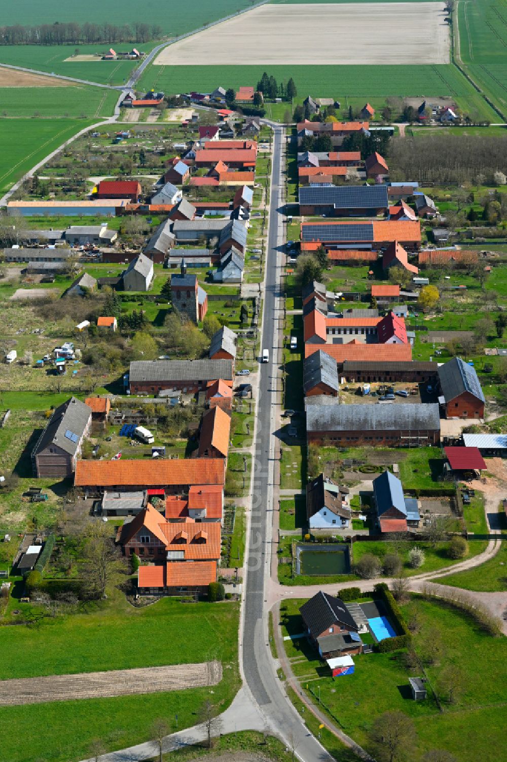 Aerial image Sanne - Agricultural land and field boundaries surround the settlement area of the village in Sanne in the state Saxony-Anhalt, Germany