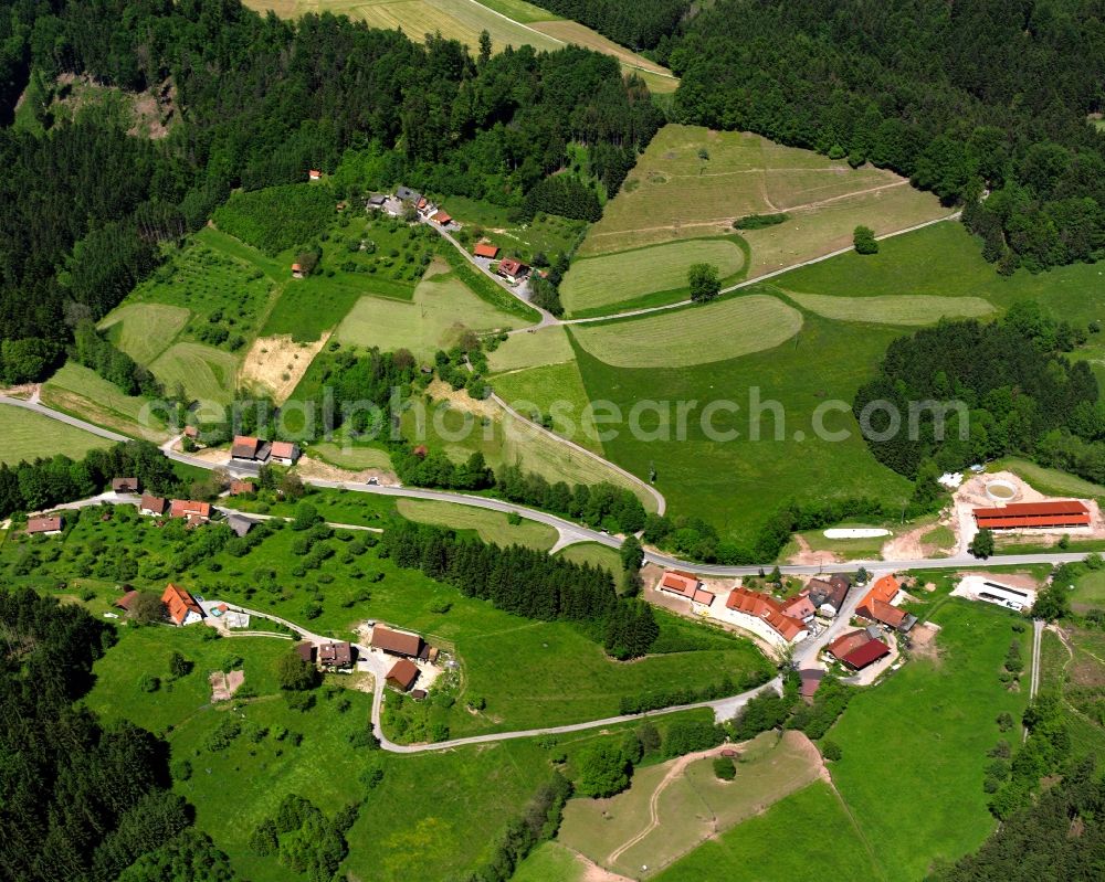 Sauerhöfle from above - Agricultural land and field boundaries surround the settlement area of the village in Sauerhöfle in the state Baden-Wuerttemberg, Germany