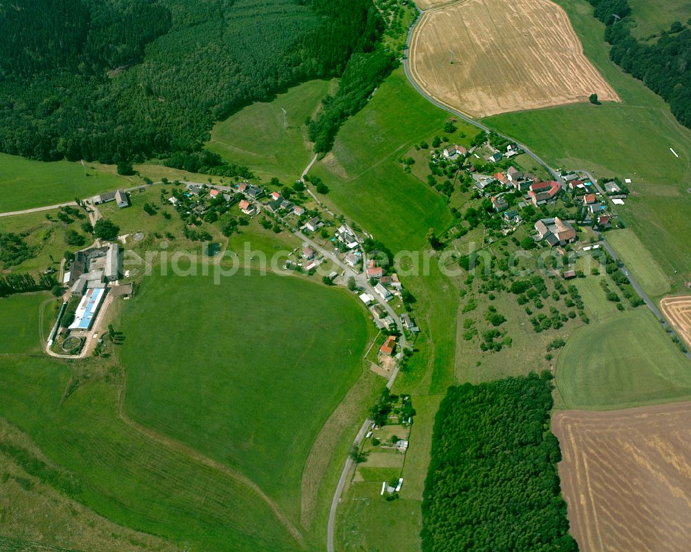 Aerial image Schafpreskeln - Agricultural land and field boundaries surround the settlement area of the village in Schafpreskeln in the state Thuringia, Germany