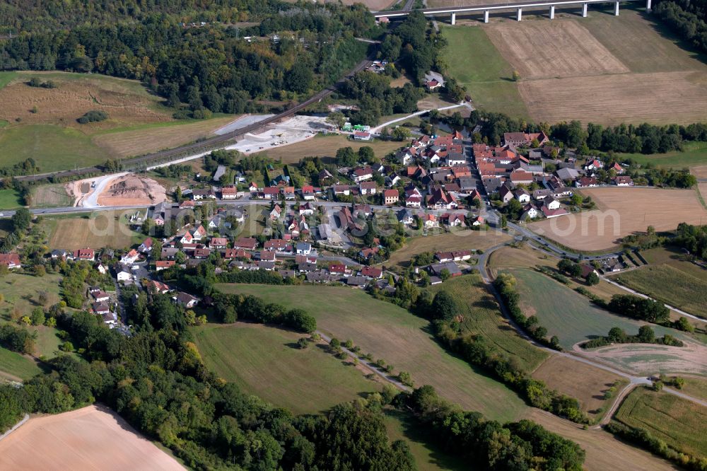 Aerial photograph Schaippach - Agricultural land and field boundaries surround the settlement area of the village in Schaippach in the state Bavaria, Germany