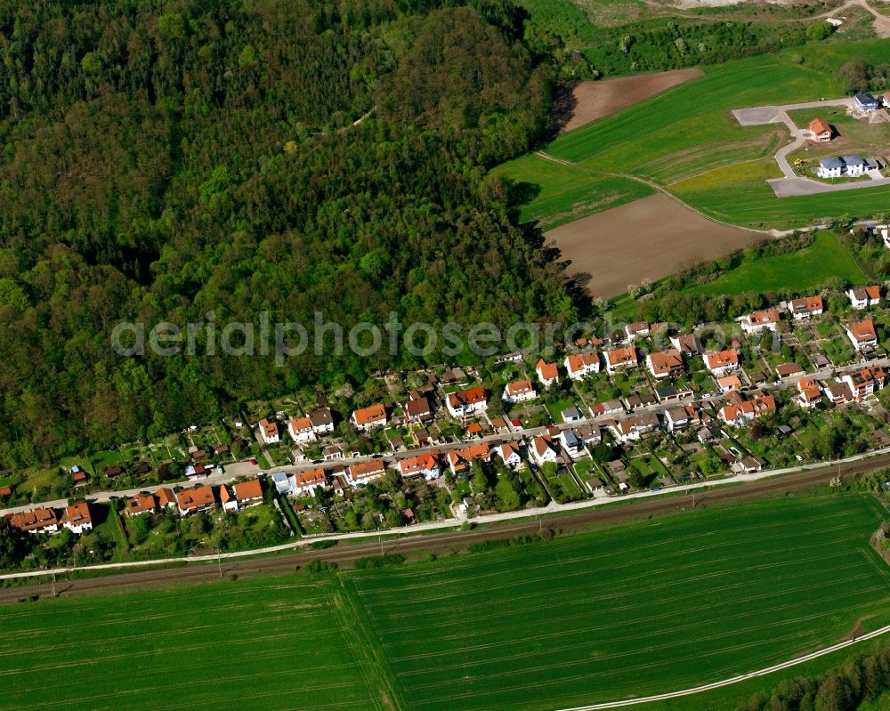 Schalkhausen from the bird's eye view: Agricultural land and field boundaries surround the settlement area of the village in Schalkhausen in the state Bavaria, Germany