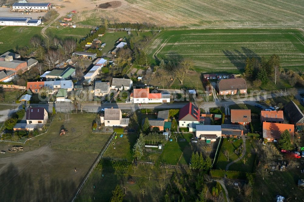 Aerial photograph Schapow - Agricultural land and field boundaries surround the settlement area of the village in Schapow Uckermark in the state Brandenburg, Germany