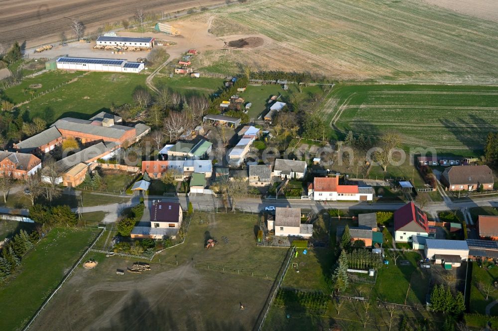 Schapow from above - Agricultural land and field boundaries surround the settlement area of the village in Schapow Uckermark in the state Brandenburg, Germany