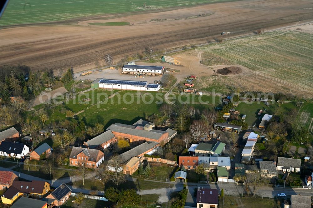 Schapow from the bird's eye view: Agricultural land and field boundaries surround the settlement area of the village in Schapow Uckermark in the state Brandenburg, Germany