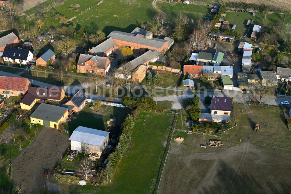 Aerial photograph Schapow - Agricultural land and field boundaries surround the settlement area of the village in Schapow Uckermark in the state Brandenburg, Germany