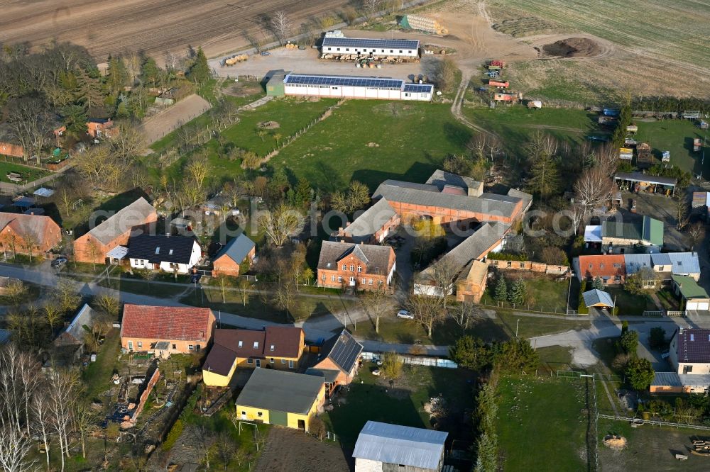 Schapow from above - Agricultural land and field boundaries surround the settlement area of the village in Schapow Uckermark in the state Brandenburg, Germany