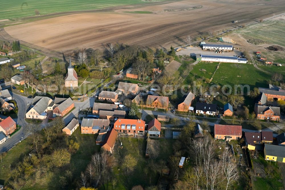 Aerial photograph Schapow - Agricultural land and field boundaries surround the settlement area of the village in Schapow Uckermark in the state Brandenburg, Germany