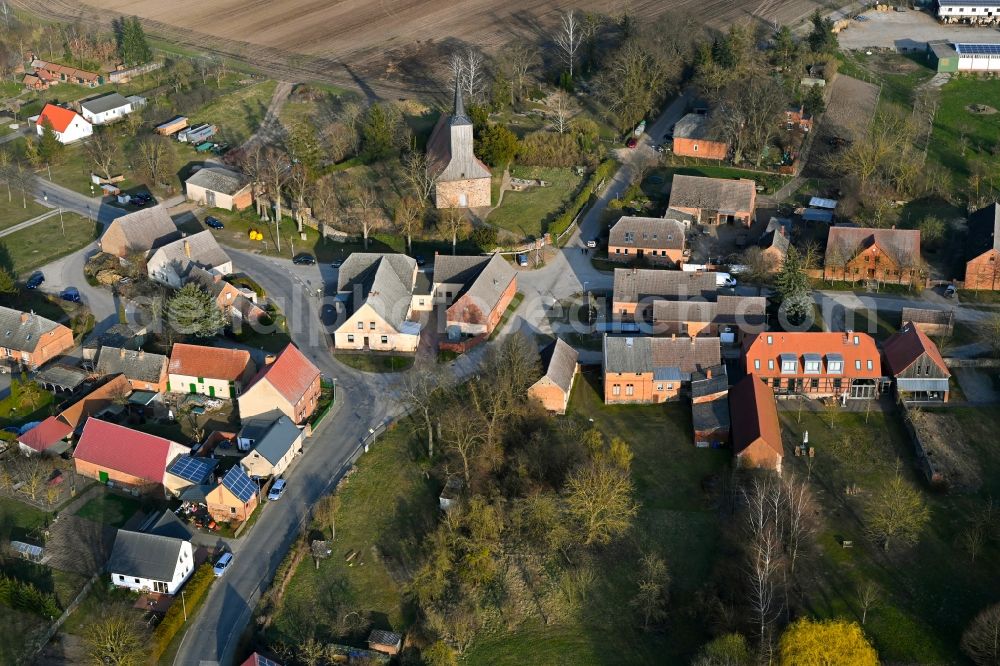 Schapow from above - Agricultural land and field boundaries surround the settlement area of the village in Schapow Uckermark in the state Brandenburg, Germany