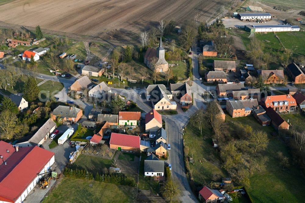 Schapow from the bird's eye view: Agricultural land and field boundaries surround the settlement area of the village in Schapow Uckermark in the state Brandenburg, Germany