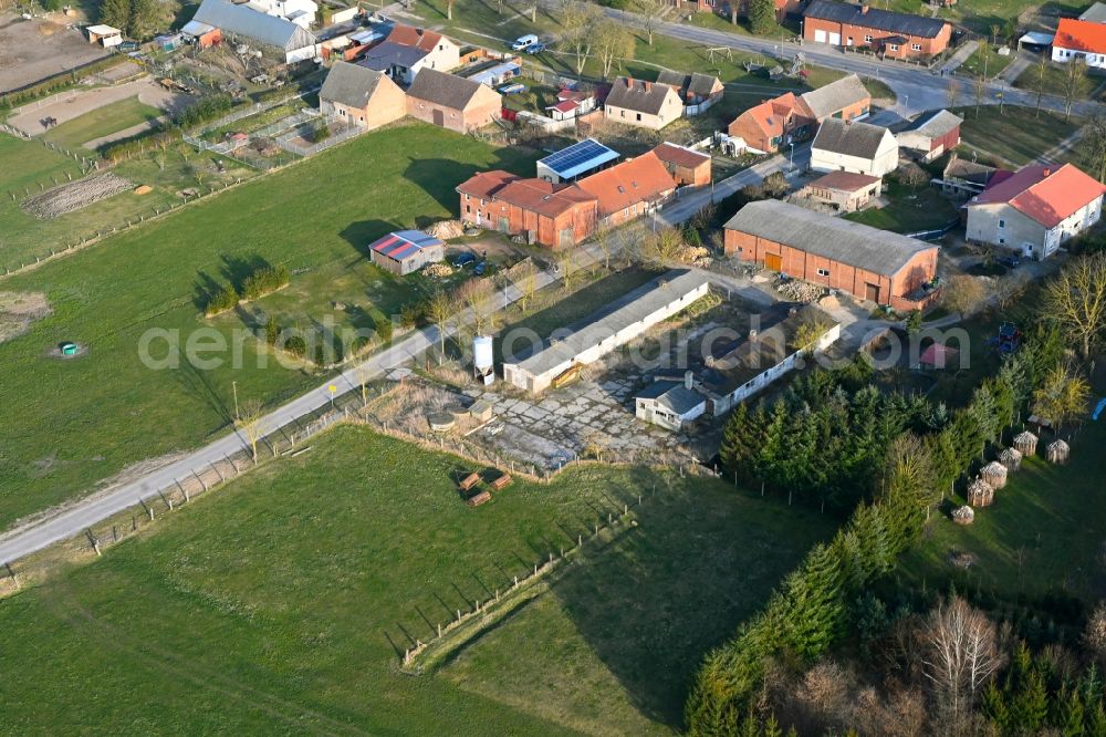 Aerial photograph Schapow - Agricultural land and field boundaries surround the settlement area of the village in Schapow Uckermark in the state Brandenburg, Germany