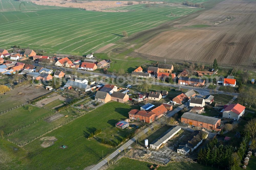 Schapow from above - Agricultural land and field boundaries surround the settlement area of the village in Schapow Uckermark in the state Brandenburg, Germany