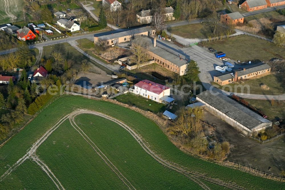 Schapow from above - Agricultural land and field boundaries surround the settlement area of the village in Schapow Uckermark in the state Brandenburg, Germany