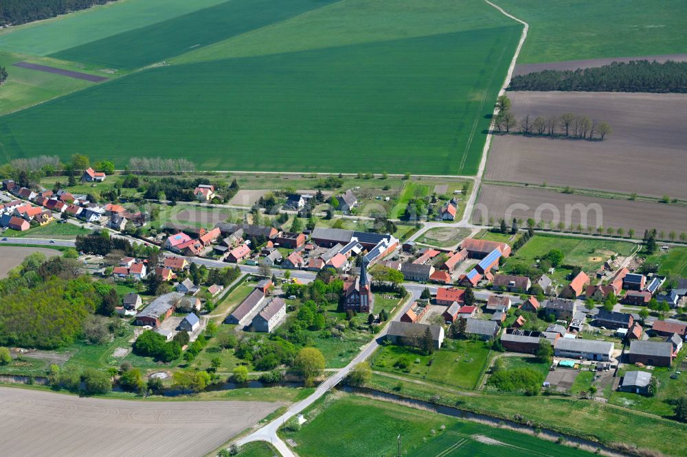 Scharlibbe from above - Agricultural land and field boundaries surround the settlement area of the village in Scharlibbe in the state Saxony-Anhalt, Germany