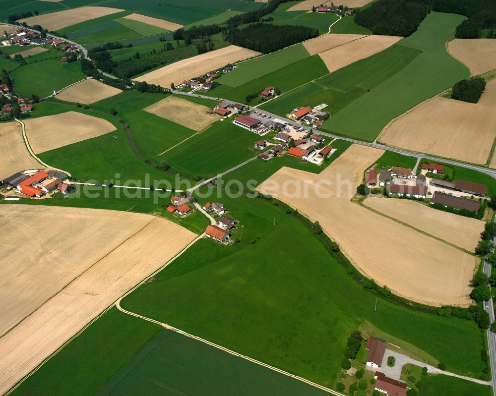 Aerial photograph Schernegg - Agricultural land and field boundaries surround the settlement area of the village in Schernegg in the state Bavaria, Germany