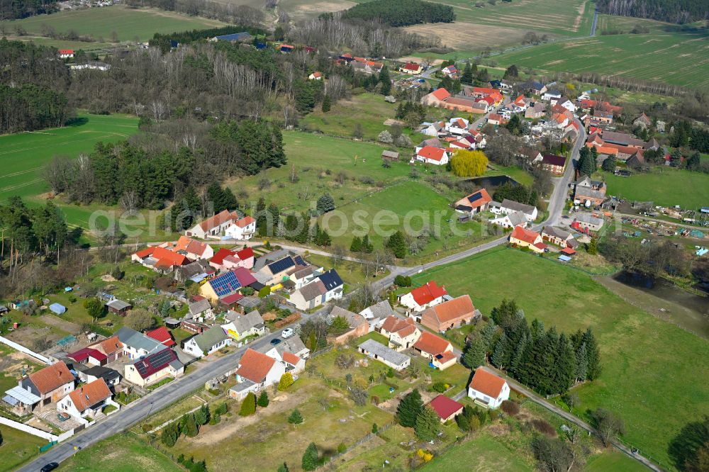 Aerial photograph Schlamau - Agricultural land and field boundaries surround the settlement area of the village in Schlamau in the state Brandenburg, Germany