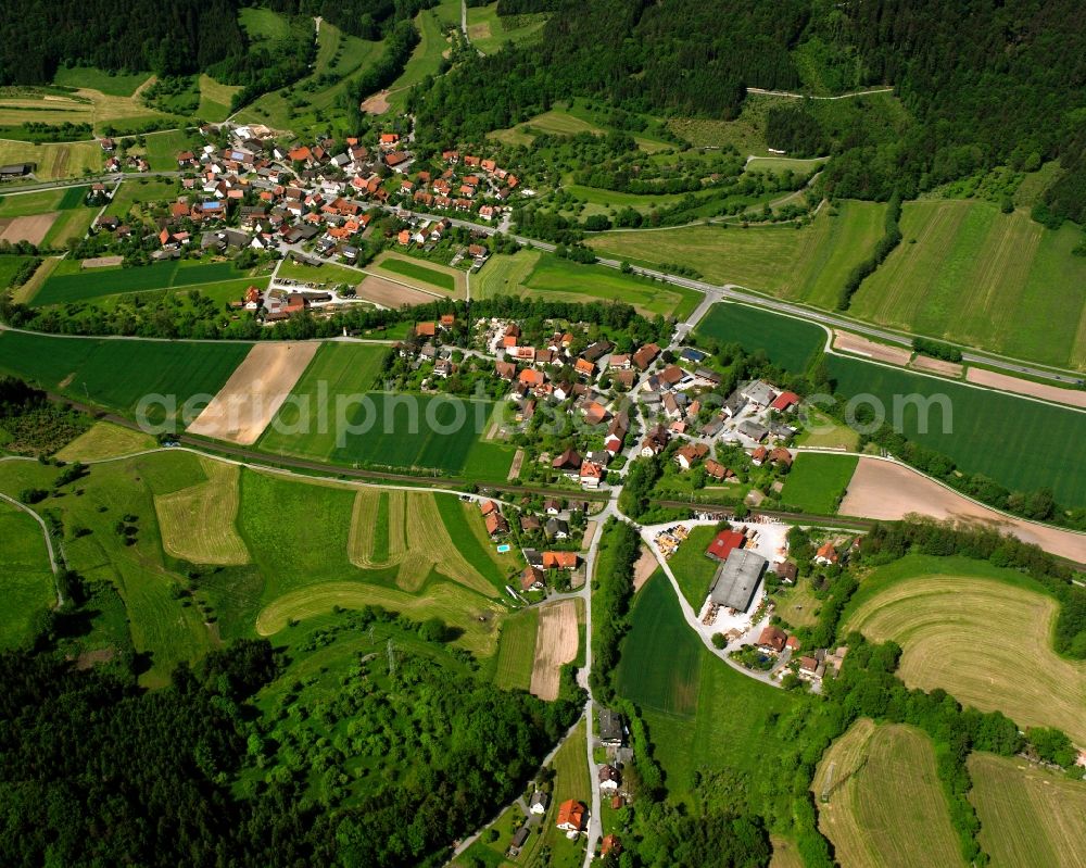 Schleißweiler from above - Agricultural land and field boundaries surround the settlement area of the village in Schleißweiler in the state Baden-Wuerttemberg, Germany