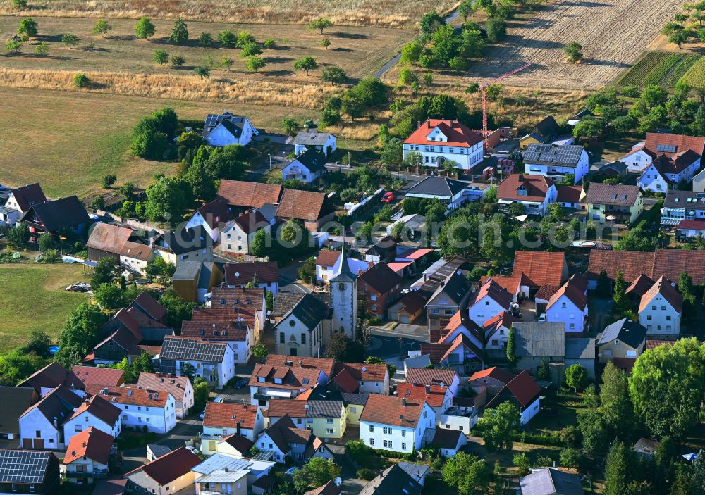 Schlimpfhof from the bird's eye view: Agricultural land and field boundaries surround the settlement area of the village in Schlimpfhof in the state Bavaria, Germany