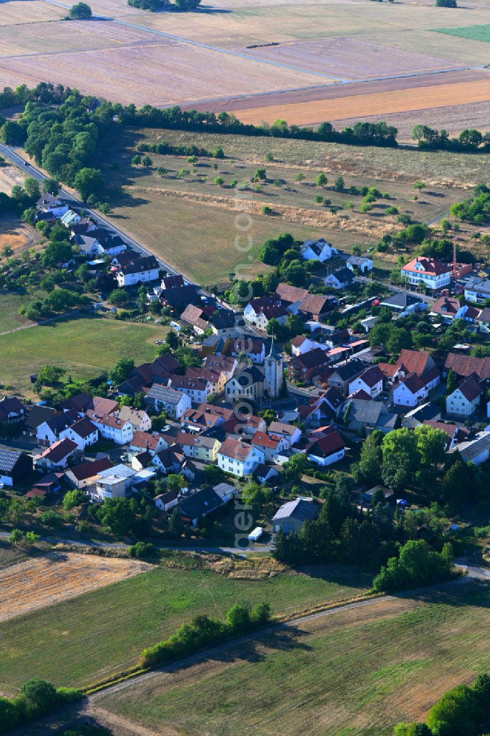 Aerial image Schlimpfhof - Agricultural land and field boundaries surround the settlement area of the village in Schlimpfhof in the state Bavaria, Germany