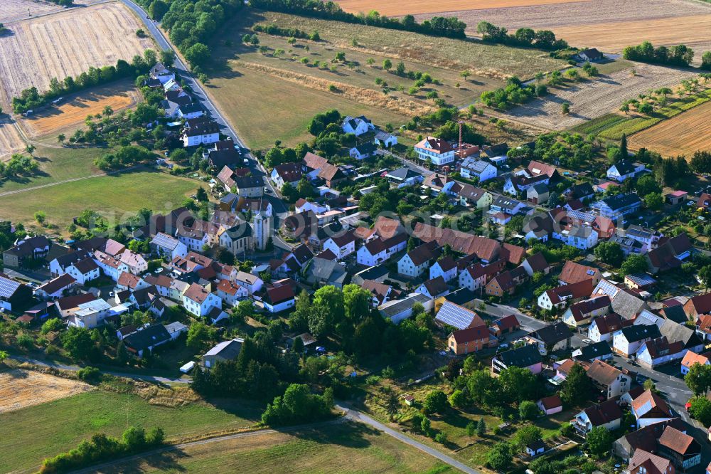 Aerial photograph Schlimpfhof - Agricultural land and field boundaries surround the settlement area of the village in Schlimpfhof in the state Bavaria, Germany