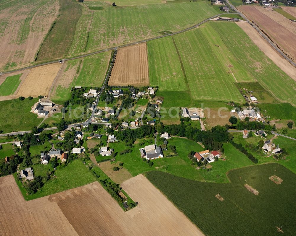 Schmalbach from the bird's eye view: Agricultural land and field boundaries surround the settlement area of the village in Schmalbach in the state Saxony, Germany