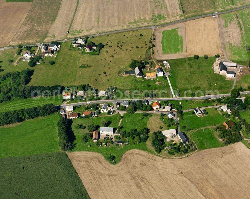 Aerial image Schmalbach - Agricultural land and field boundaries surround the settlement area of the village in Schmalbach in the state Saxony, Germany