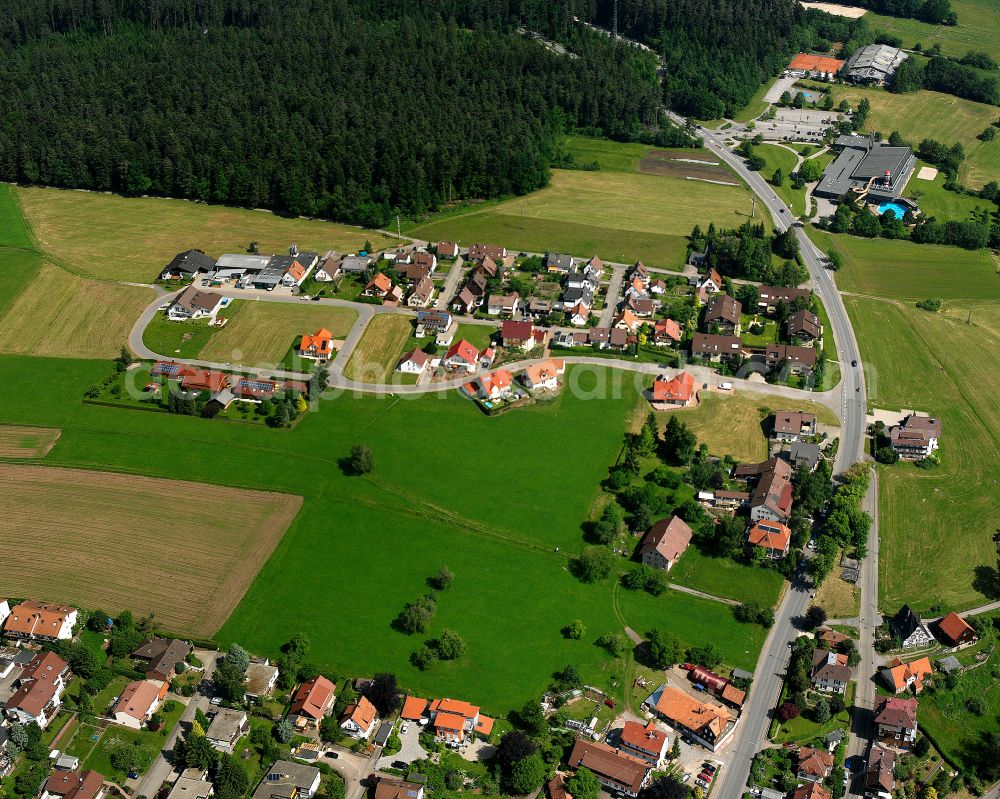 Schömberg from above - Agricultural land and field boundaries surround the settlement area of the village in Schömberg in the state Baden-Wuerttemberg, Germany