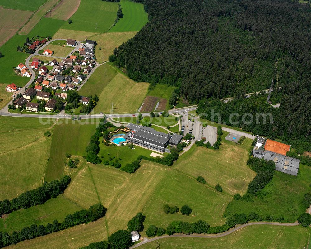 Schömberg from the bird's eye view: Agricultural land and field boundaries surround the settlement area of the village in Schömberg in the state Baden-Wuerttemberg, Germany