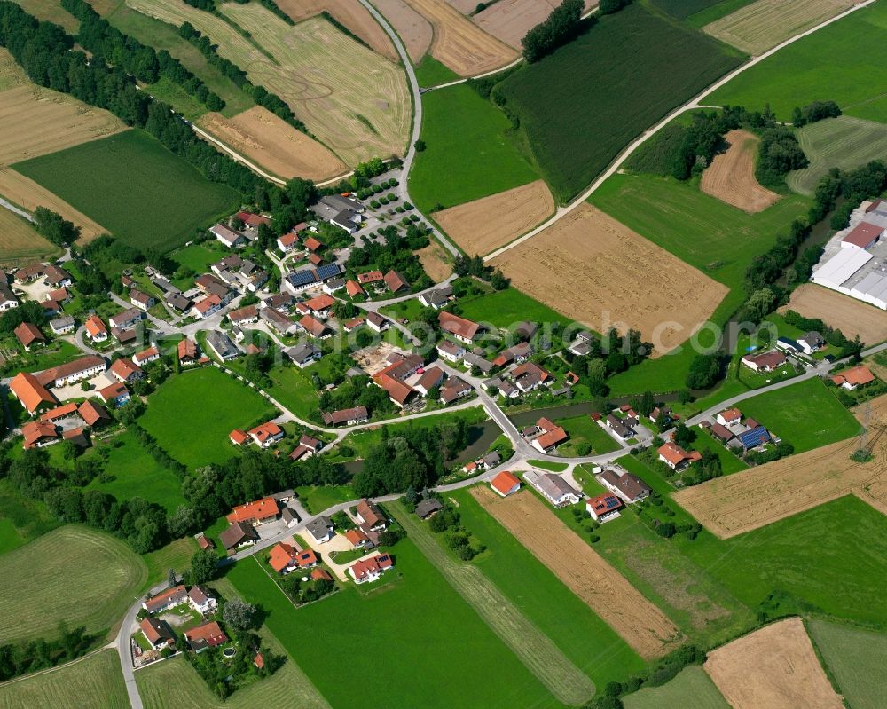 Schmiedorf from above - Agricultural land and field boundaries surround the settlement area of the village in Schmiedorf in the state Bavaria, Germany