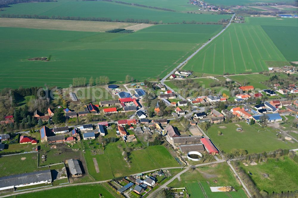 Aerial image Schmolde - Agricultural land and field boundaries surround the settlement area of the village in Schmolde in the state Brandenburg, Germany