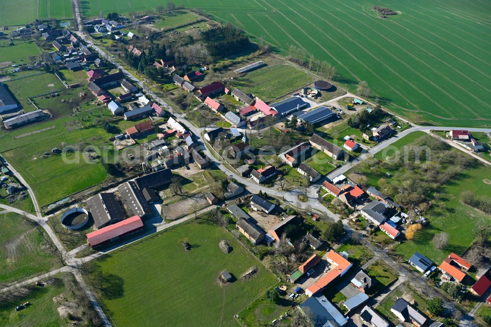 Schmolde from above - Agricultural land and field boundaries surround the settlement area of the village in Schmolde in the state Brandenburg, Germany