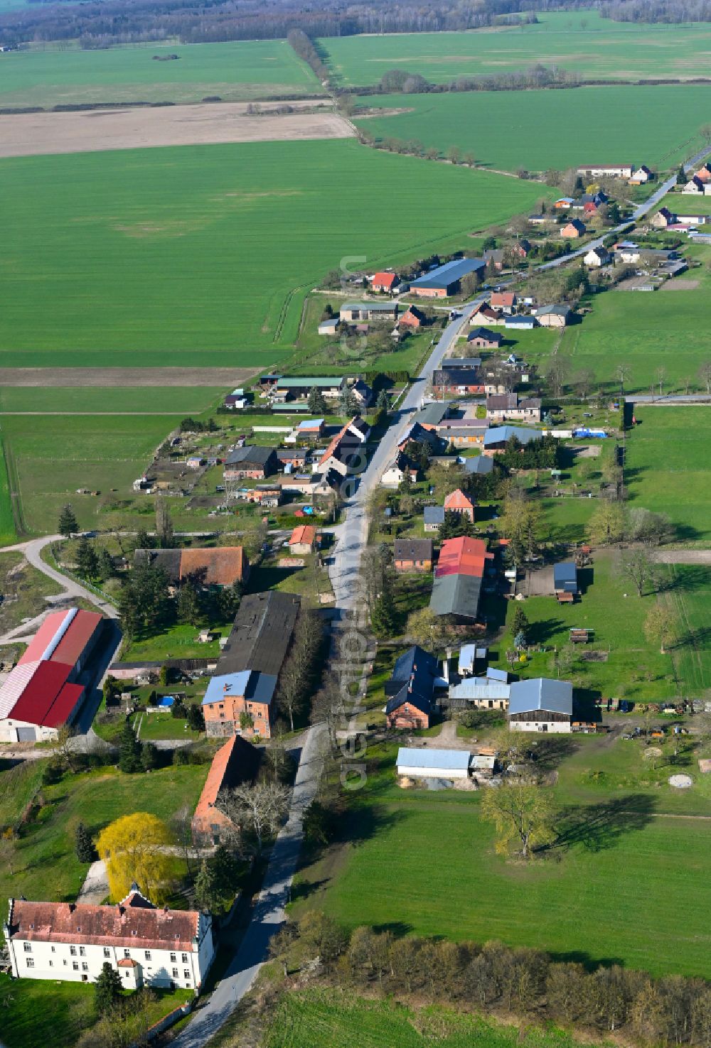 Aerial image Schmolde - Agricultural land and field boundaries surround the settlement area of the village in Schmolde in the state Brandenburg, Germany