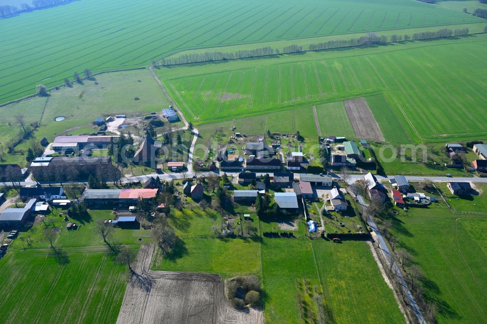 Aerial photograph Schmolde - Agricultural land and field boundaries surround the settlement area of the village in Schmolde in the state Brandenburg, Germany