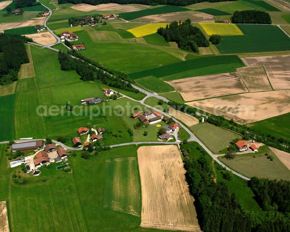 Aerial photograph Schönau - Agricultural land and field boundaries surround the settlement area of the village in Schönau in the state Bavaria, Germany